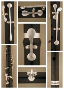 [Photo collage of forged sterling silver keys on a blackwood Casey Burns Irish flute]